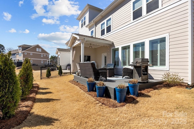 view of side of property featuring a patio and fence