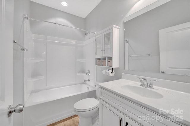 full bath featuring washtub / shower combination, vanity, toilet, and tile patterned floors