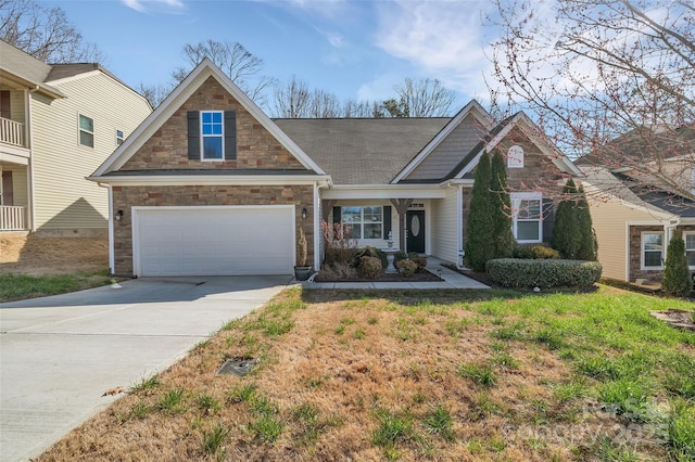 view of front of home with driveway, stone siding, and a front yard