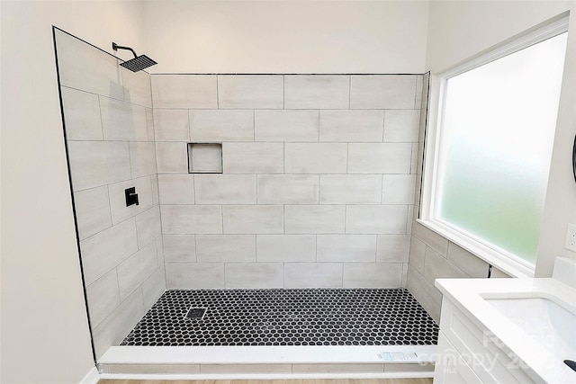 bathroom featuring vanity and a shower stall