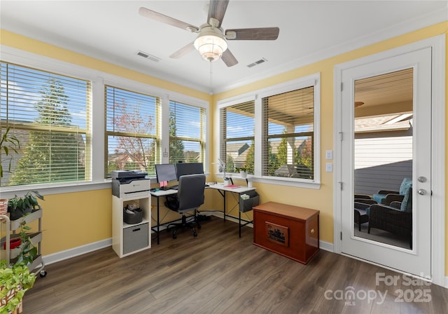 office space featuring a ceiling fan, wood finished floors, visible vents, and baseboards