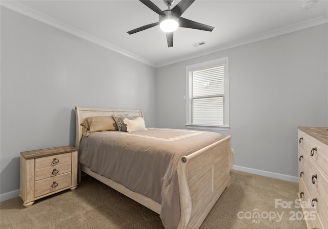 bedroom featuring baseboards, light colored carpet, and crown molding