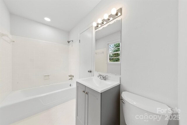 full bathroom featuring toilet, vanity, and shower / bathtub combination