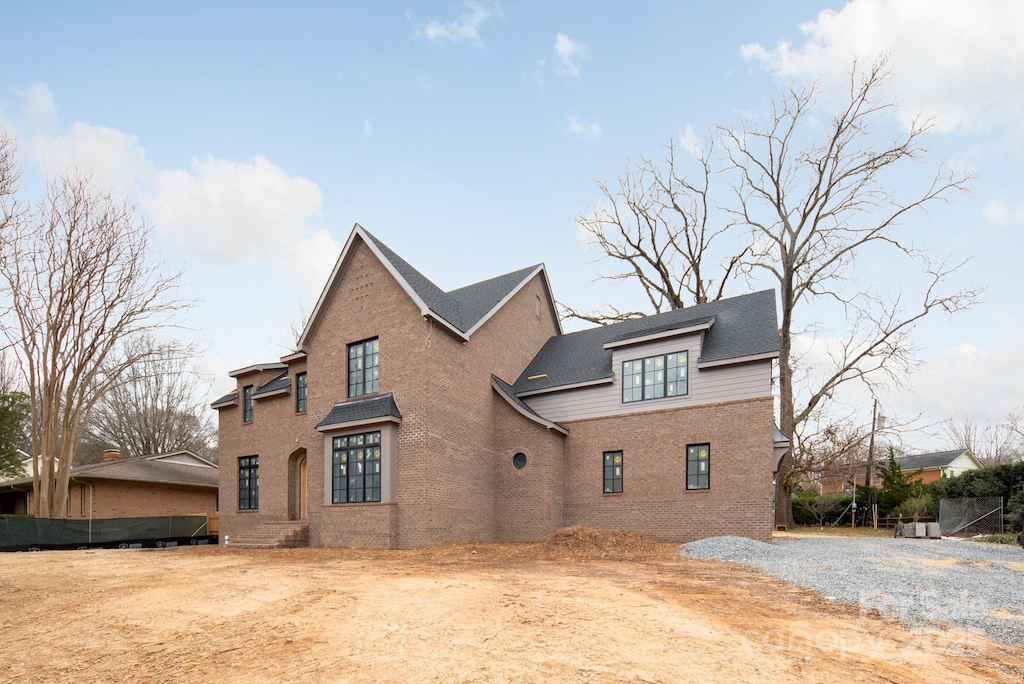 view of home's exterior with brick siding