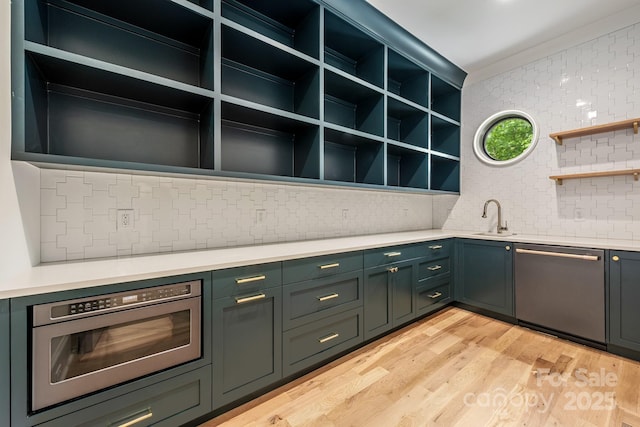 5124 Lansing Dr, Charlotte, NC 28270 - kitchen with stainless steel appliances, open shelves, a sink, backsplash, and light countertops