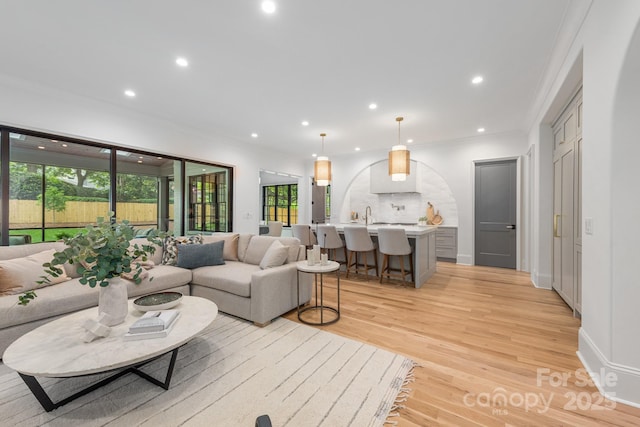 5124 Lansing Dr, Charlotte, NC 28270 - living room featuring ornamental molding, recessed lighting, and light wood-type flooring