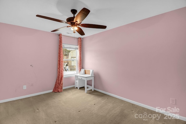 unfurnished room with carpet flooring, visible vents, baseboards, and ceiling fan