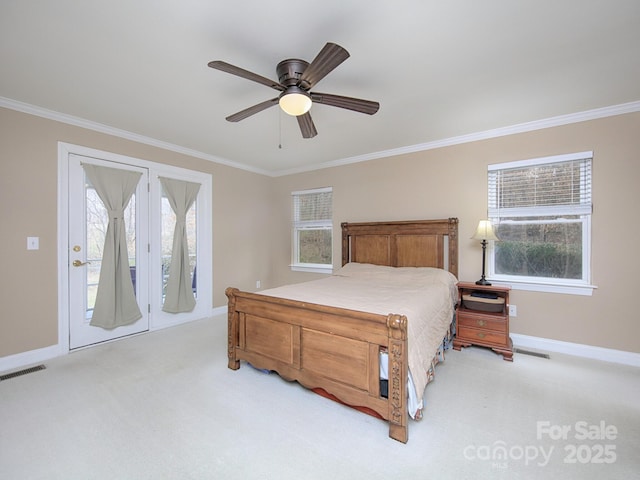 bedroom featuring multiple windows, visible vents, and carpet flooring