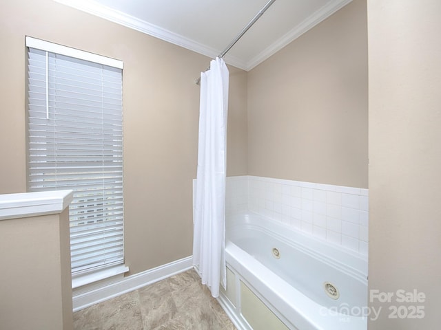 full bathroom featuring ornamental molding, a jetted tub, and baseboards