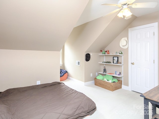 carpeted bedroom with ceiling fan, vaulted ceiling, visible vents, and baseboards