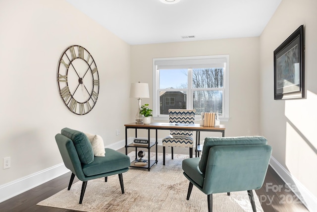 office with visible vents, baseboards, and wood finished floors