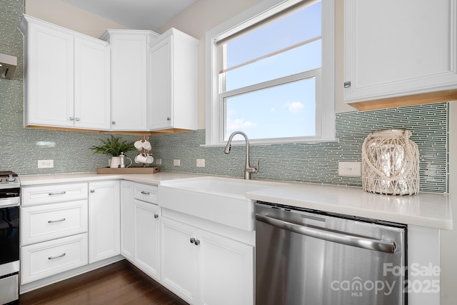 kitchen featuring white cabinetry, light countertops, tasteful backsplash, and stainless steel appliances