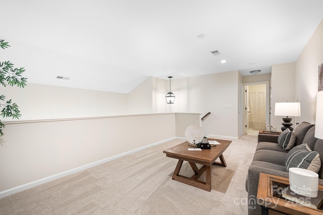 living area with light colored carpet, recessed lighting, baseboards, and visible vents