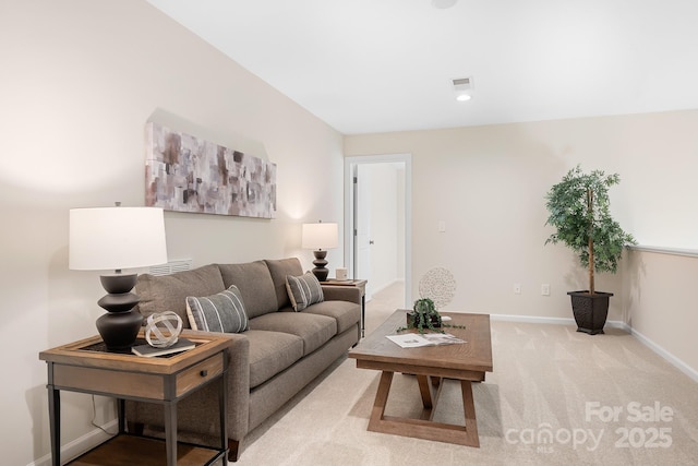 living room with baseboards, visible vents, and light carpet