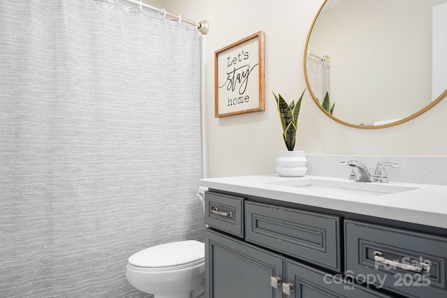 full bath with vanity and toilet