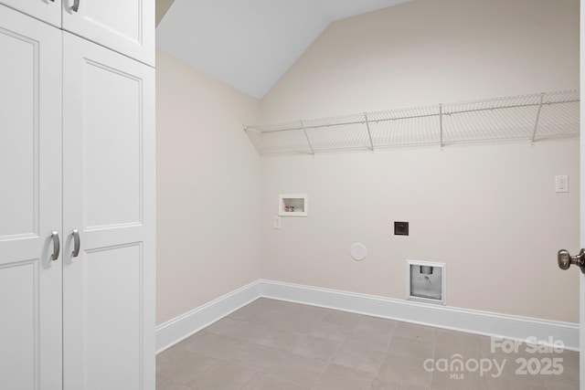 laundry room featuring baseboards, gas dryer hookup, hookup for a washing machine, cabinet space, and hookup for an electric dryer