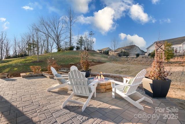 view of patio with an outdoor fire pit