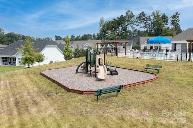 community jungle gym with fence, a residential view, a lawn, a community pool, and a pergola