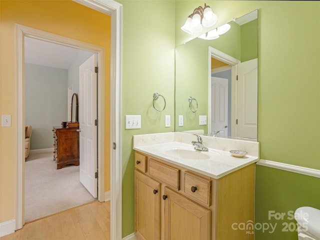 bathroom with vanity and baseboards