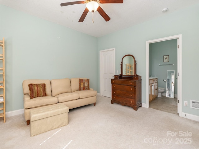 carpeted living room featuring visible vents, a ceiling fan, and baseboards