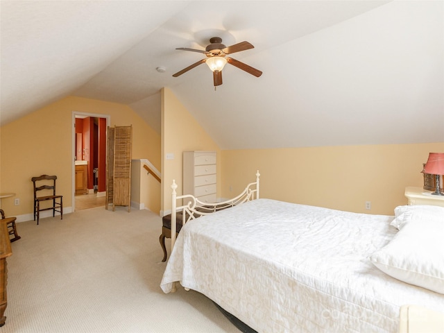 bedroom featuring light carpet, ceiling fan, baseboards, and vaulted ceiling