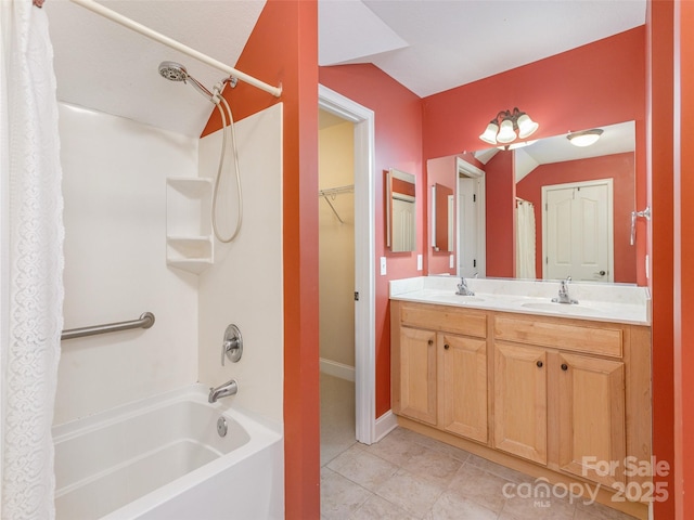 full bathroom featuring tile patterned floors, a sink, shower / bathtub combination with curtain, and double vanity