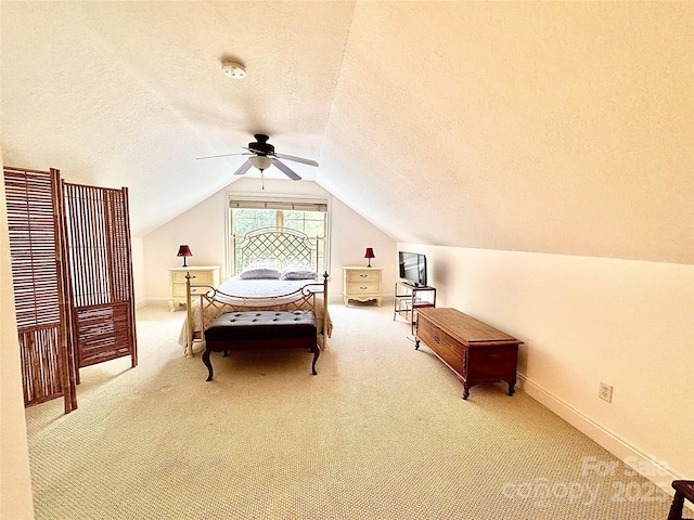 carpeted bedroom featuring vaulted ceiling, baseboards, a textured ceiling, and ceiling fan