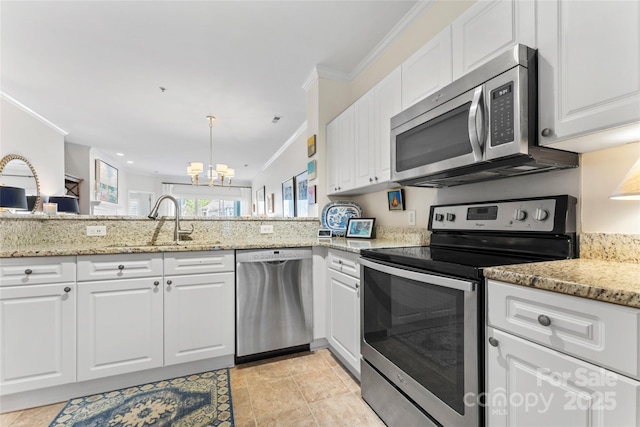 kitchen with light stone counters, a chandelier, white cabinetry, stainless steel appliances, and ornamental molding