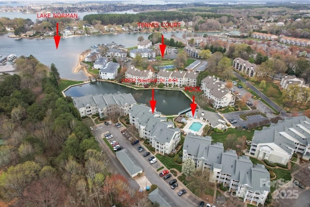 birds eye view of property with a residential view and a water view