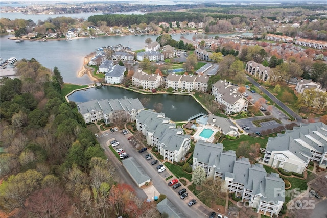 bird's eye view featuring a residential view and a water view