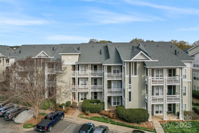 view of property featuring uncovered parking