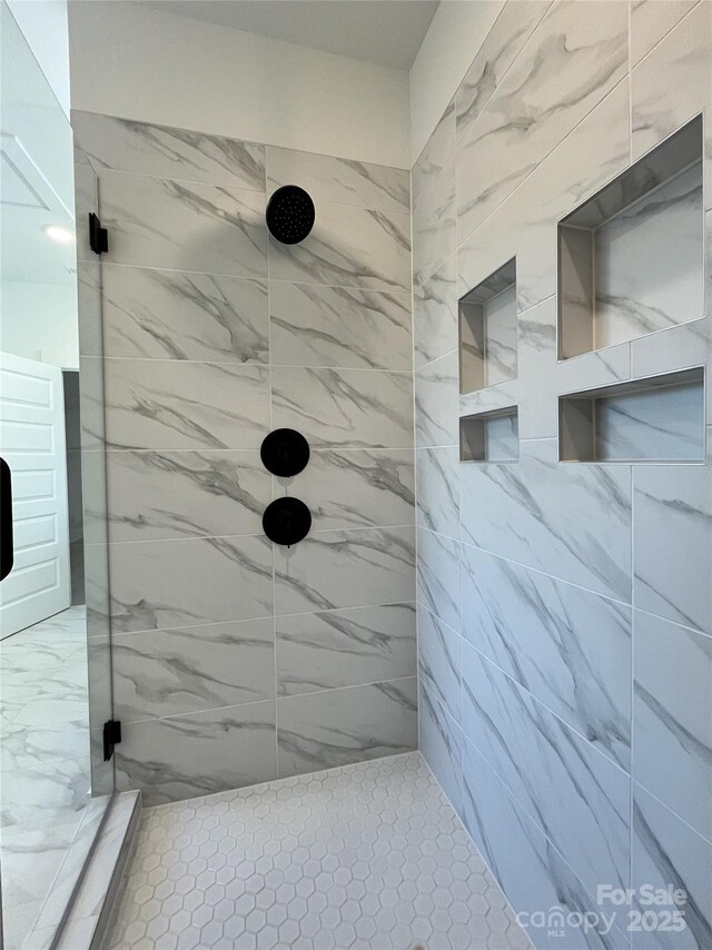 bathroom with a stall shower