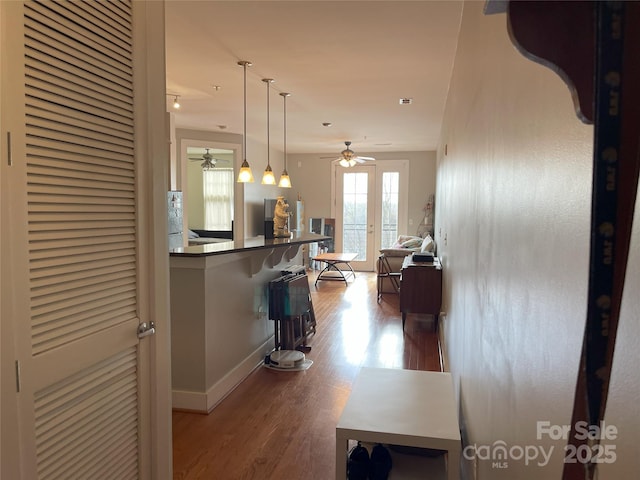 hall with wood finished floors