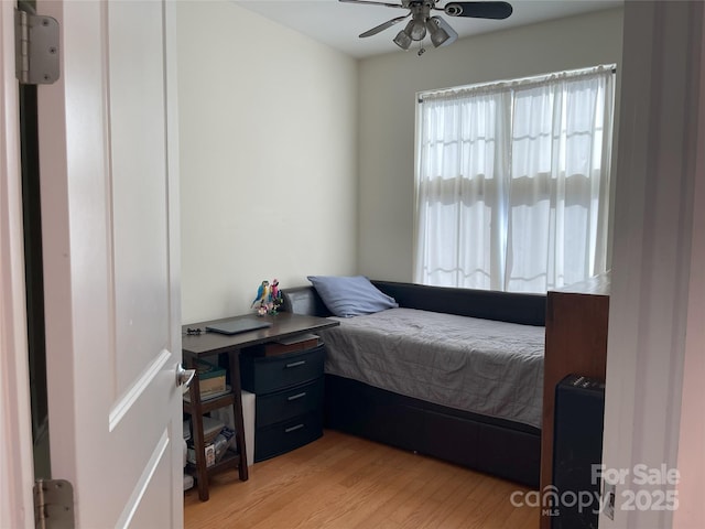 bedroom featuring light wood-style floors and ceiling fan