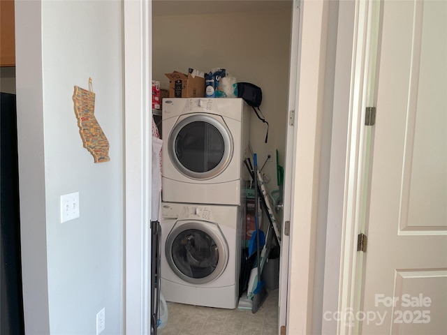 laundry room featuring laundry area and stacked washing maching and dryer