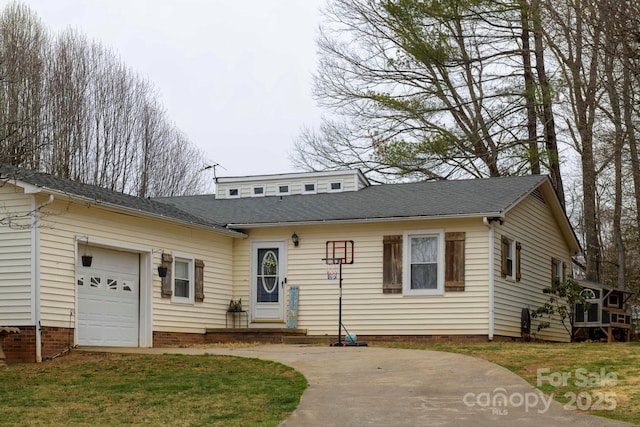 view of front of house featuring a garage, roof with shingles, and entry steps