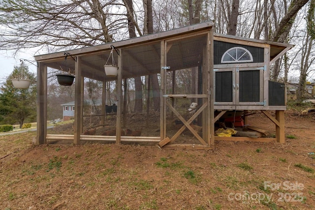 view of poultry coop with a carport