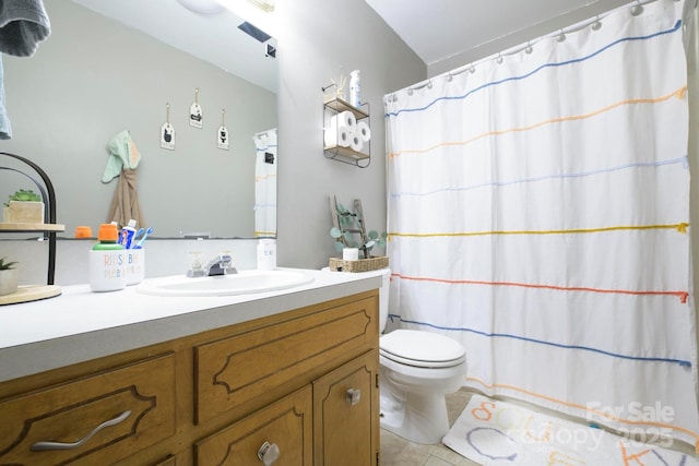 bathroom with vanity, curtained shower, tile patterned flooring, and toilet