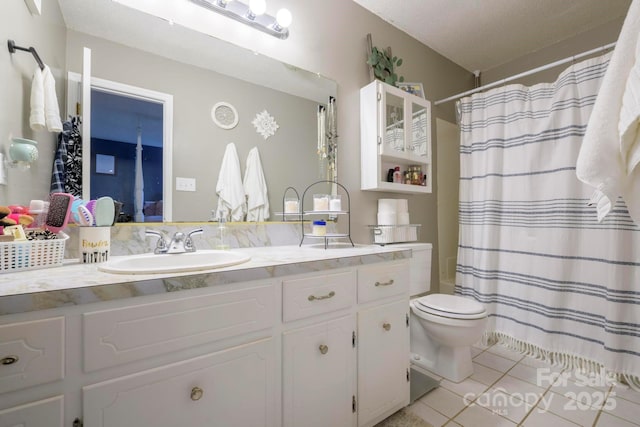 full bath featuring vanity, tile patterned flooring, toilet, and a shower with curtain