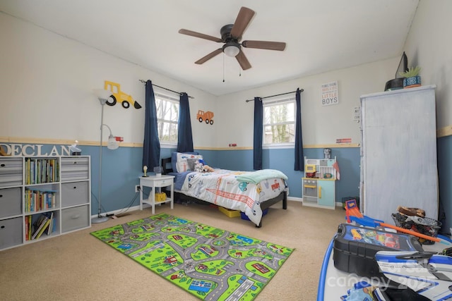 bedroom featuring carpet, baseboards, and ceiling fan