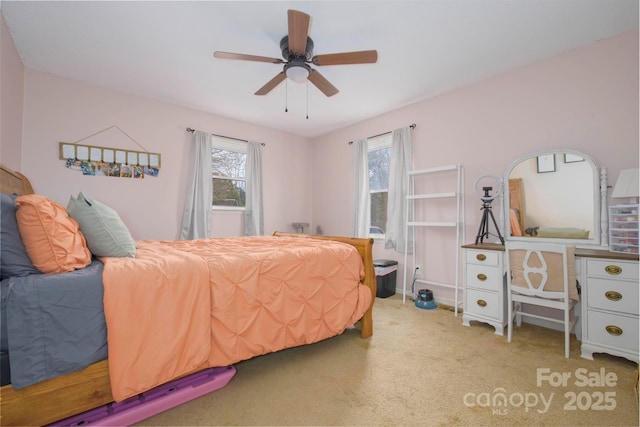 carpeted bedroom featuring a ceiling fan