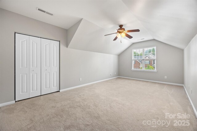 bonus room featuring carpet floors, a ceiling fan, baseboards, and vaulted ceiling