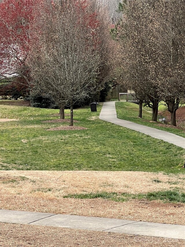 view of home's community featuring a lawn