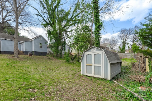 view of shed with fence
