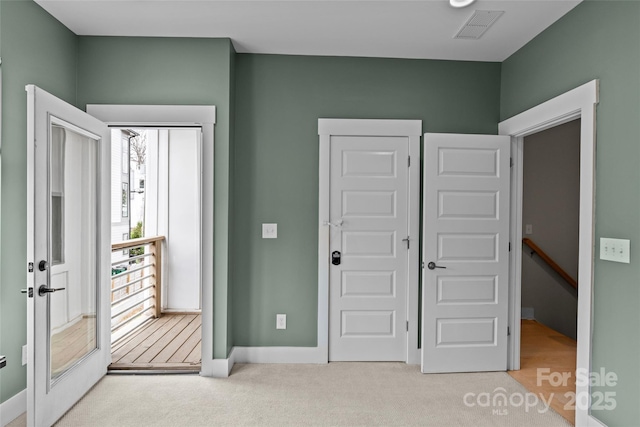 bedroom featuring visible vents, baseboards, and carpet