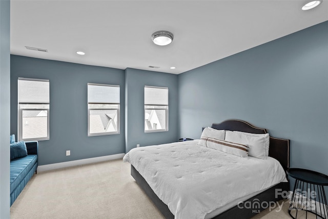 bedroom with visible vents, recessed lighting, baseboards, and carpet