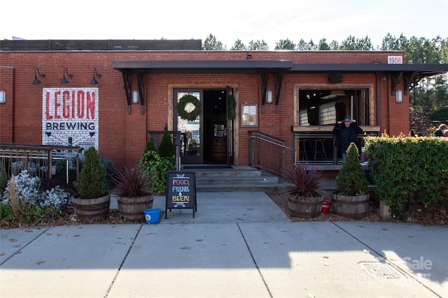 entrance to property with brick siding