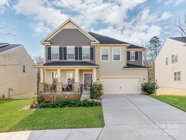 craftsman-style home featuring a porch, an attached garage, concrete driveway, board and batten siding, and a front yard