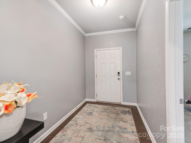 doorway featuring baseboards, dark wood-style flooring, and ornamental molding