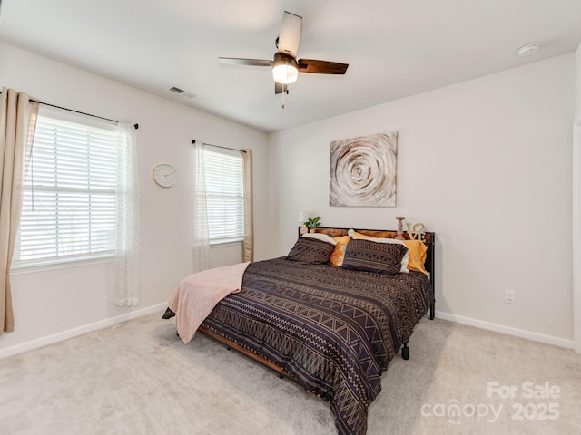 bedroom featuring ceiling fan, baseboards, and carpet flooring